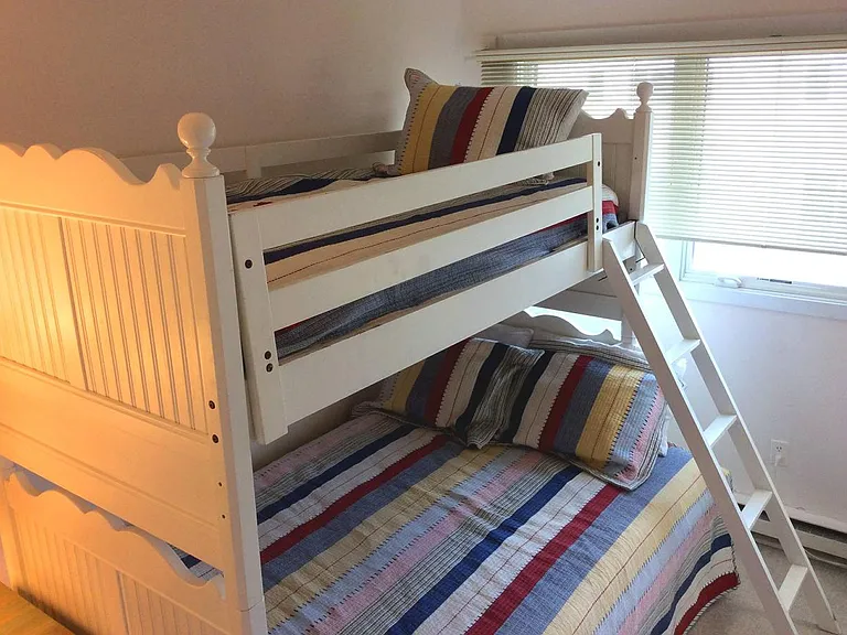 Bedroom on upper floor. Pyramid bed with pull out double bed hidden below.
