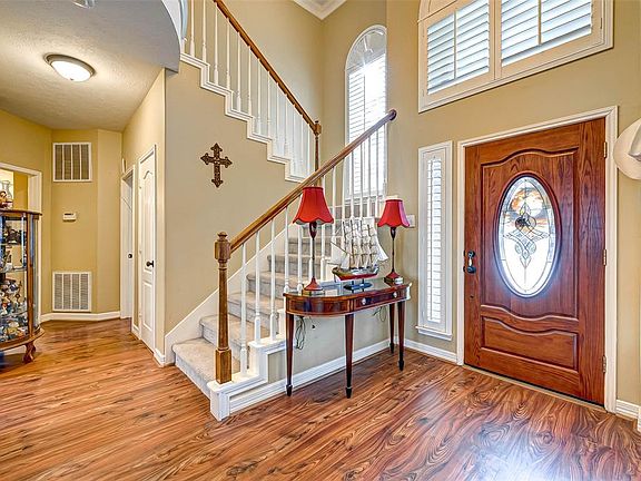 As you walk into the Beautiful Entryway the Staircase and Downstairs Bedroom are to your right.