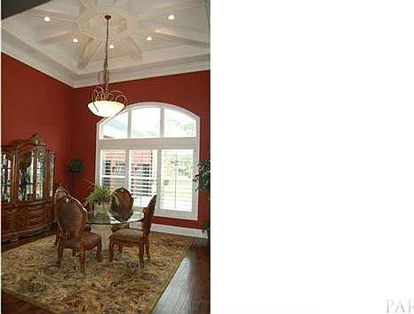 The formal dining area has high ceilings, great natural light and space to accommodate large table and seating for a crowd
