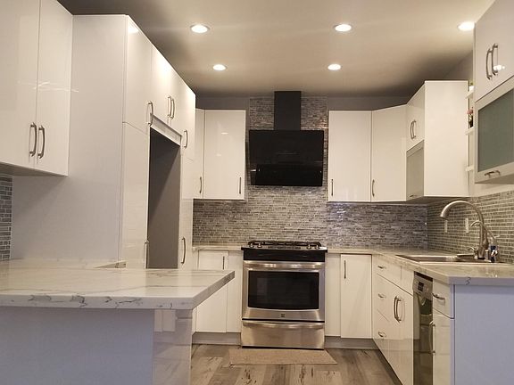 Lowe's premium kitchen cabinetry with self closing drawers & doors, upgraded faucet & sink, dimmable recessed lights, new sky light.