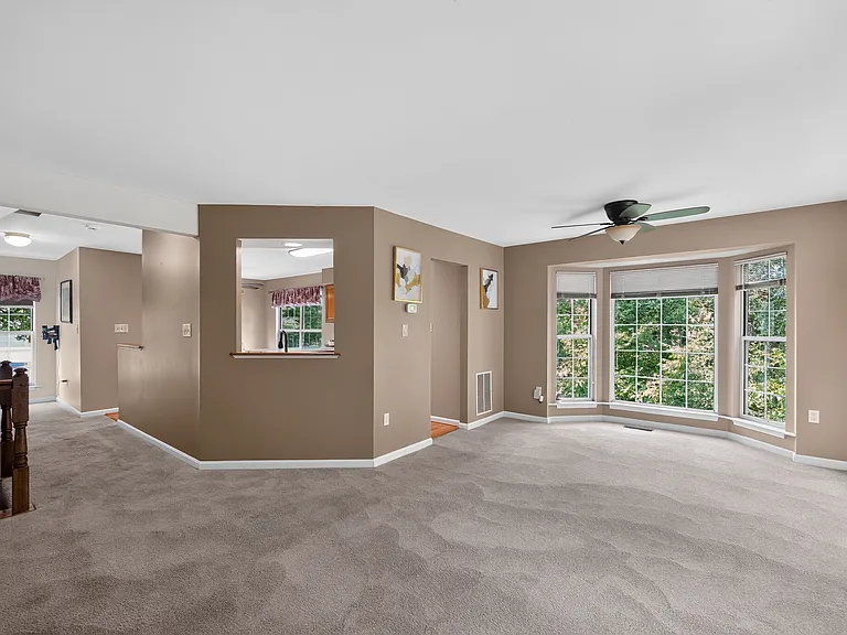 Dining Room area featuring bay windows