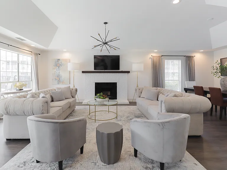 Our Montgomery apartments community features a modern lounge with cozy fireplace and entertainment center, professionally operated by Highlands Vista Group.
