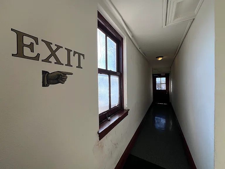 Rear exit to the fire escape.