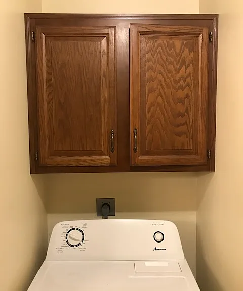 laundry Room with closets for detergent