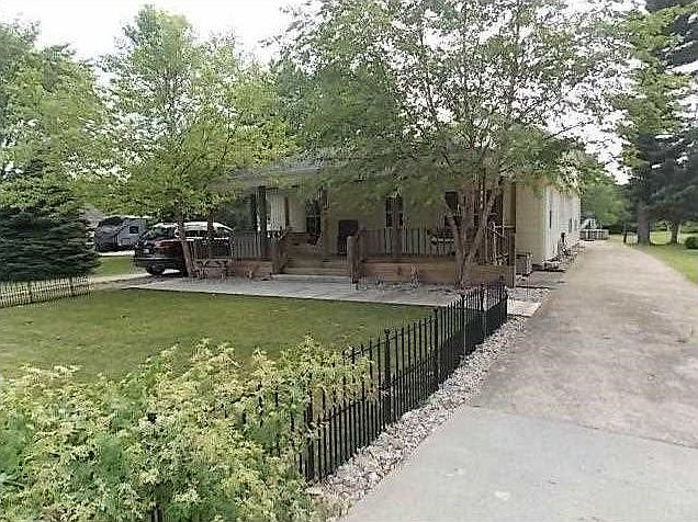 Exterior Front. Exterior view of spacious & unique 4 bedroom 3 bath home with 2624 SF. Note extra long driveway leading to the detached 2 car garage.