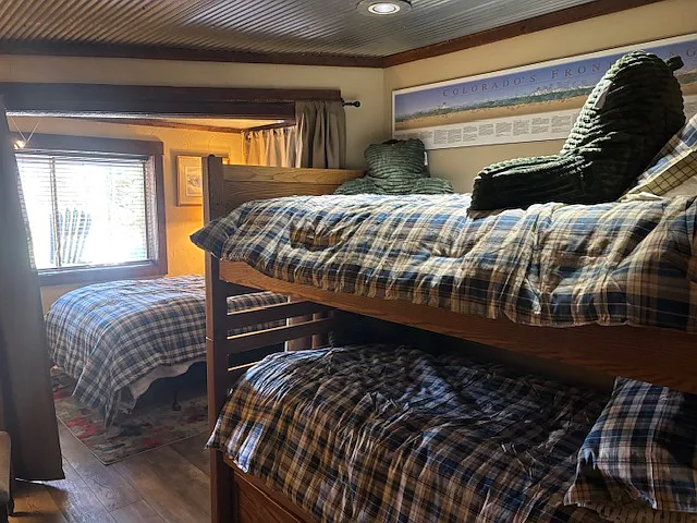 bunk beds with added trundle hidden under lower bunk