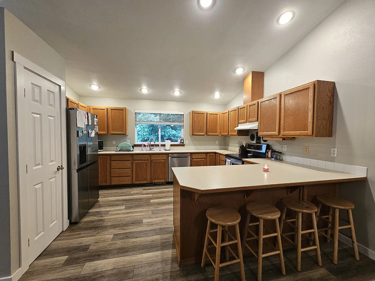 Large kitchen with plenty of cabinet storage and counter space. New stainless steal appliances. - 8532 157th Pl NW