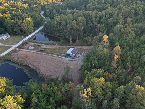 View of the east side of the property with building and 2 ponds