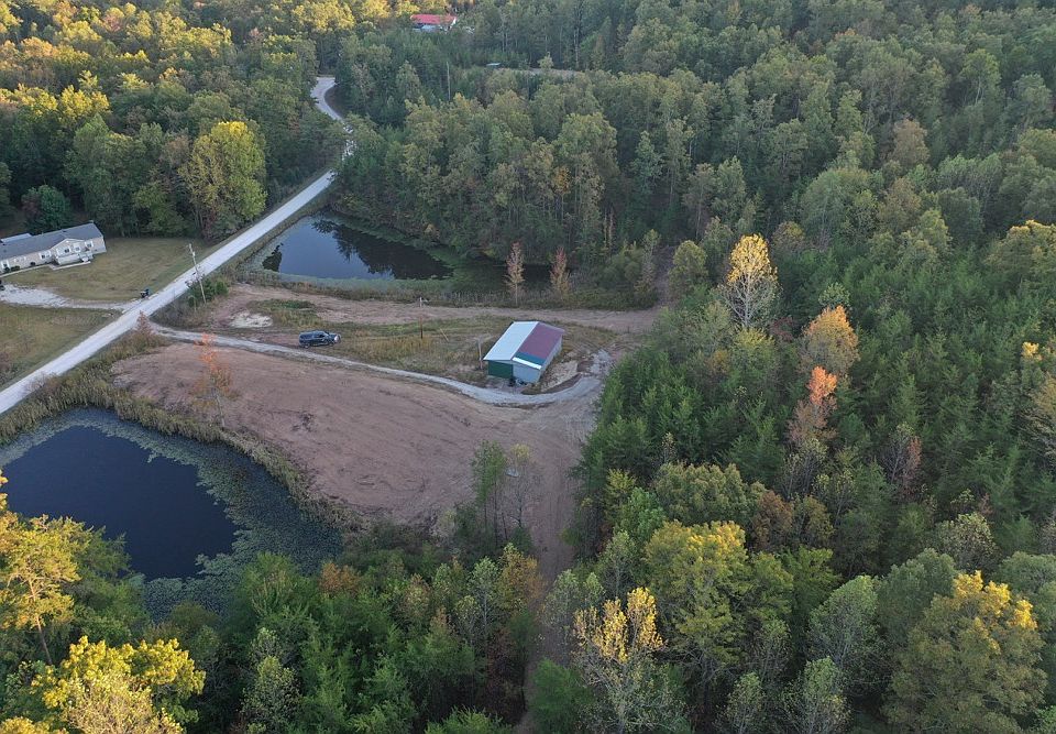 View of the east side of the property with building and 2 ponds