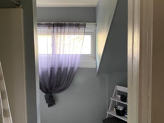 The bathroom has a shower and a new toilet and vanity