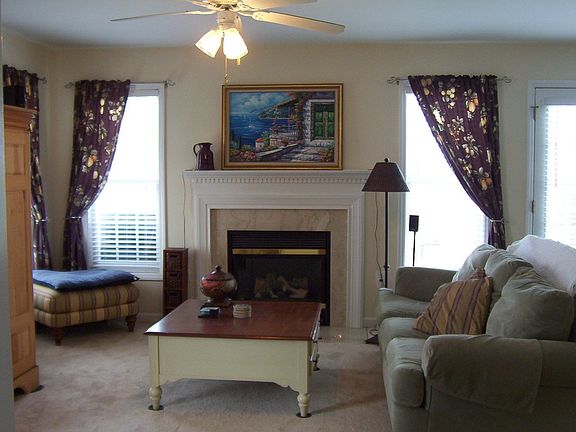 Family room with marble surround, gas log fireplace