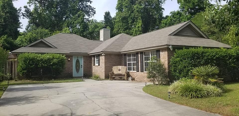 Home front with large driveway
