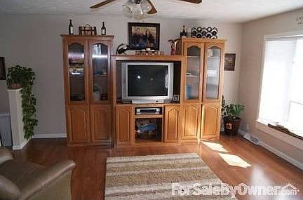 Upstairs Living Room
						:
						Wood Floor, Ceiling Fan & Bay Windows