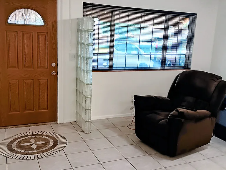 Front door and window living room area