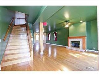 Hardwood floors and high ceilings make the living space even more expansive