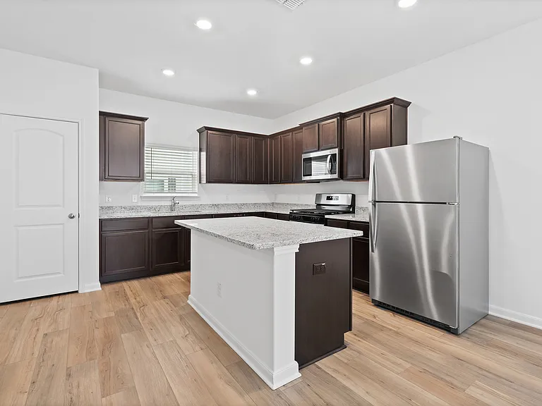 Kitchen with granite countertops.