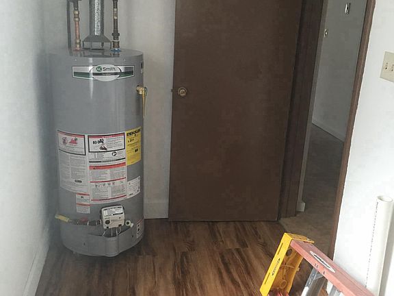 Laundry room with new hot water heater