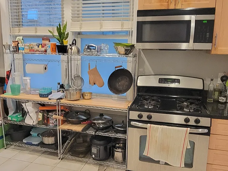 Open kitchen with stainless steel appliances