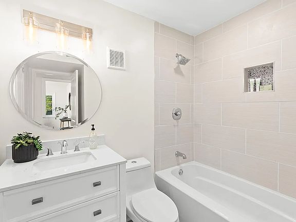 Guest bathroom with large, walk-in linen closet to the left.