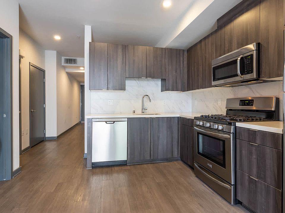 Kitchen with Stainless Steel Appliances and In-home Washer and Dryer