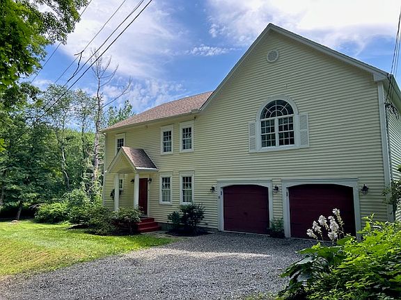 Front of house and main upper driveway