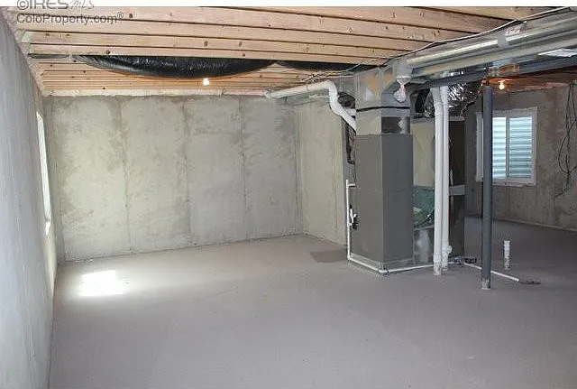 Light Filled Unfinished Basement with Enamel Flooring