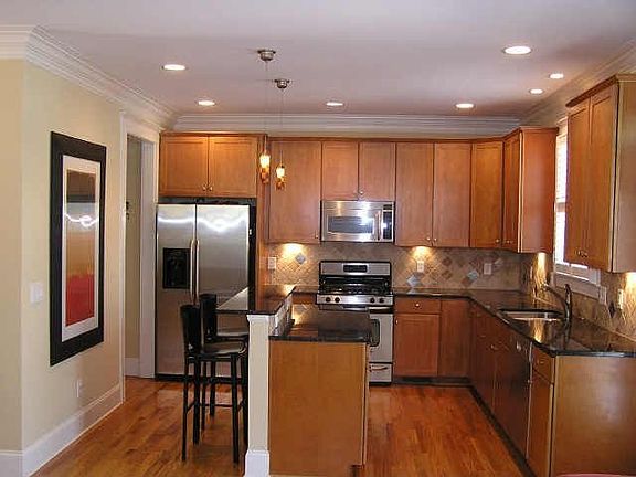 Granite Countertops, Stained Cabinets & Center Island