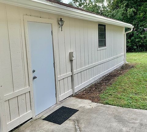 Spacious Garage With Electric Outlets, Fiberglass Security Door