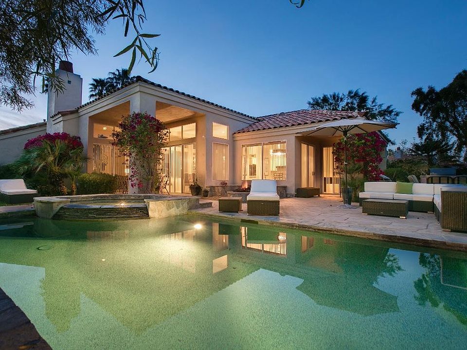 Beautiful spacious backyard with salt water pool overlooking the 8th tee.