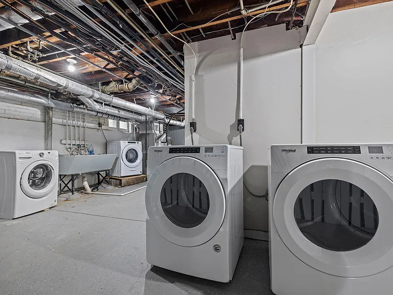 Laundry area. 4 different washer/dryer units to share amongst tenants (only 2 are pictured).
