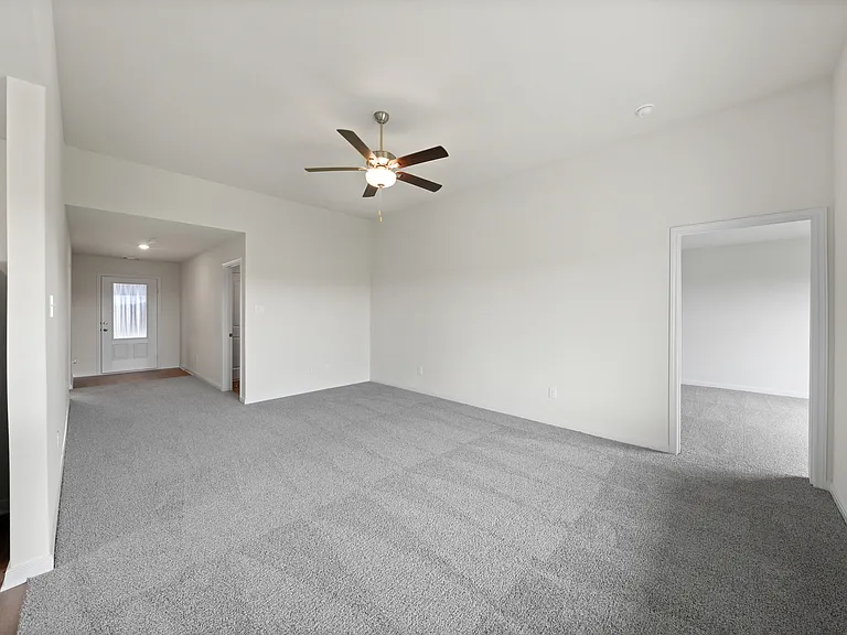 The spacious family room is perfect for family living and hosting.