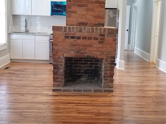 View from front door walking into open concept living room / kitchen.