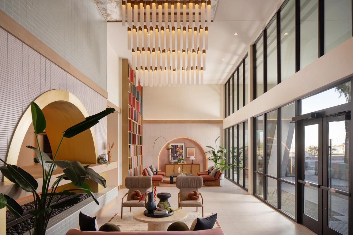 Soaring ceilings, curated desert details, and light-filled spaces set the tone at Modera Rio Salado.