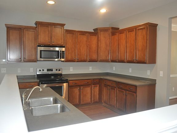 Large Kitchen with stainless Steel appliances solid surface 