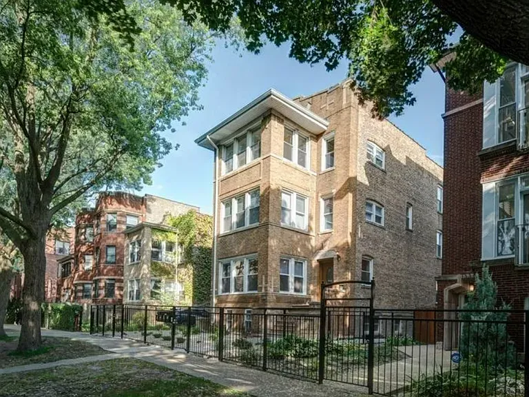 Quiet, tree-lined street with secure building access