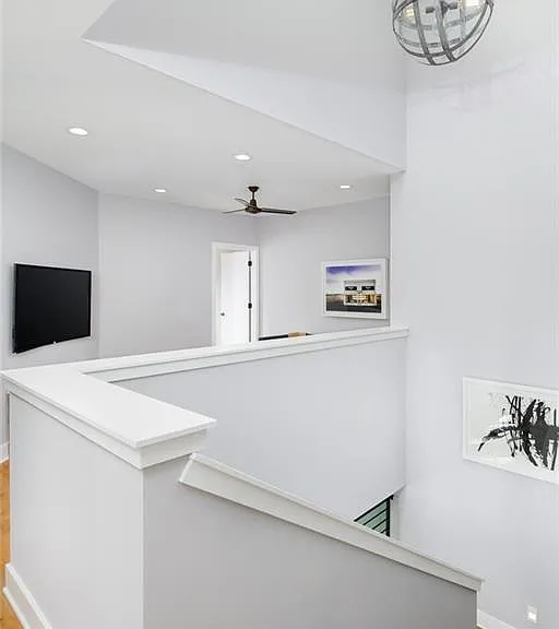 This thoughtfully designed staircase is more than a passage between floors_it is a light-filled architectural feature that enhances the home's overall aesthetic appeal, making the interior feel bright, open, and connected.