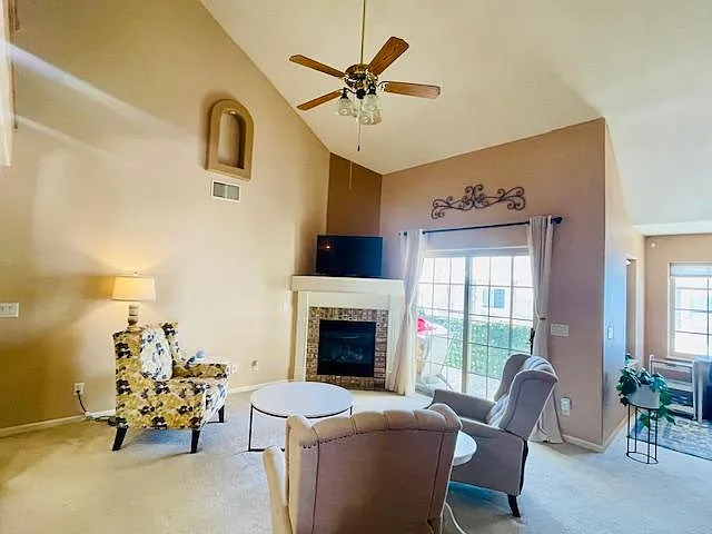 Living Space with tall 25 ft ceiling and gas fireplace