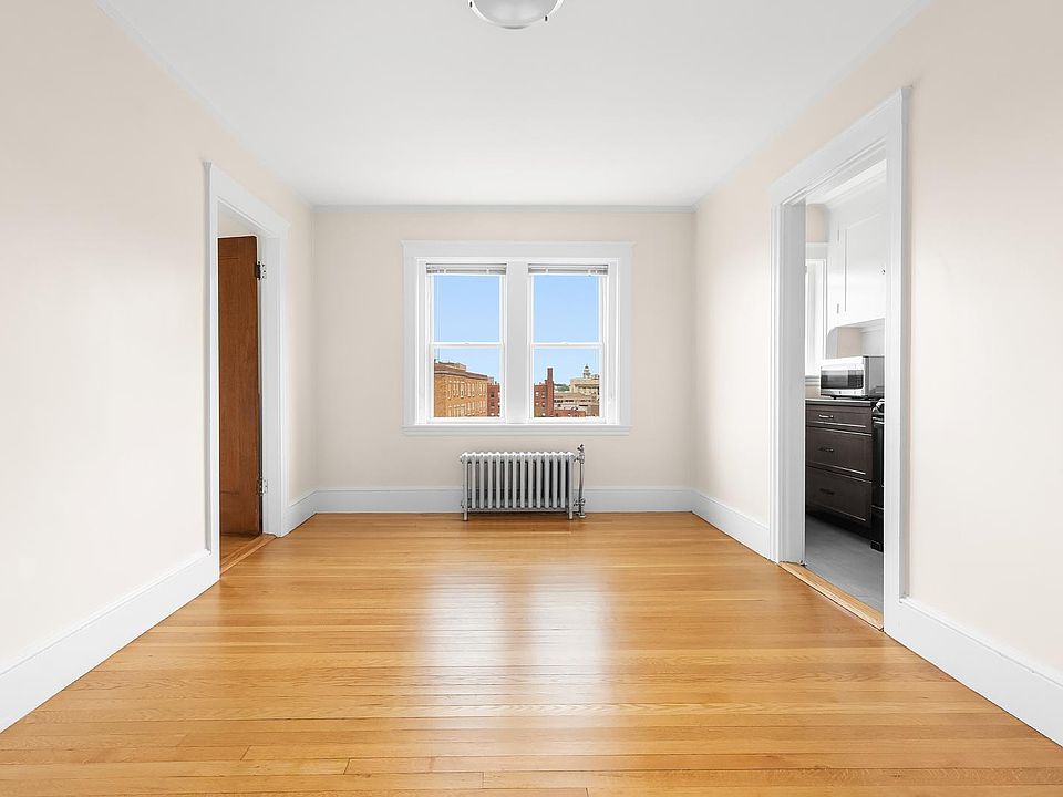 Hardwood floor throughout the livingroom and bedroom.