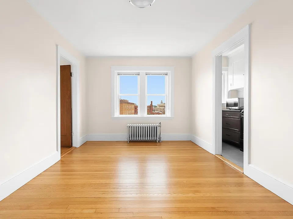 Hardwood floor throughout the livingroom and bedroom.