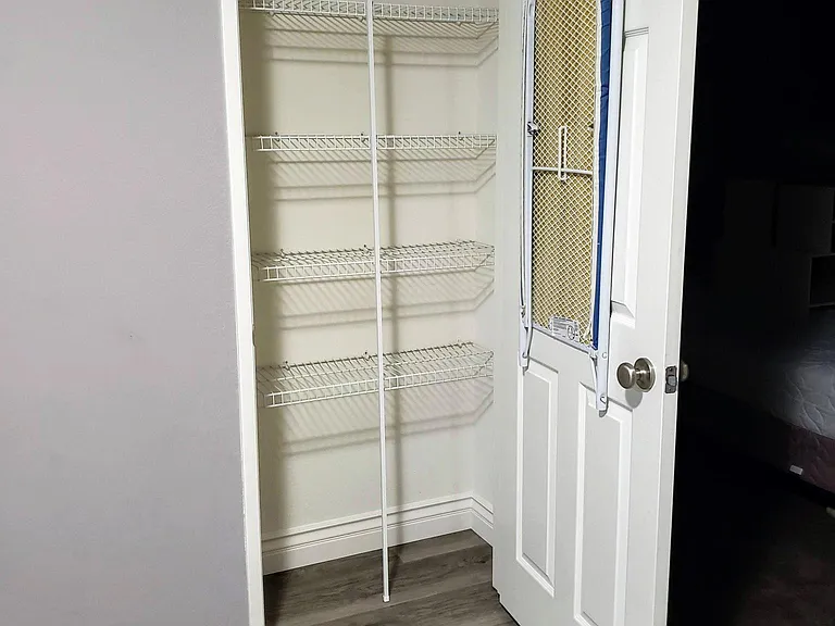 Upstairs Hallway Linen Closet with Ironing Board