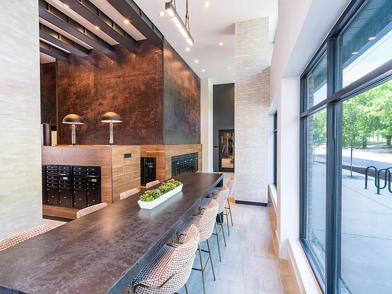 Coffee, comfort, and a curated mailroom_all in one chic lobby.