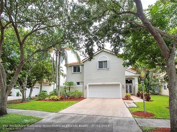 Beautiful tree lined landscaping welcomes you!