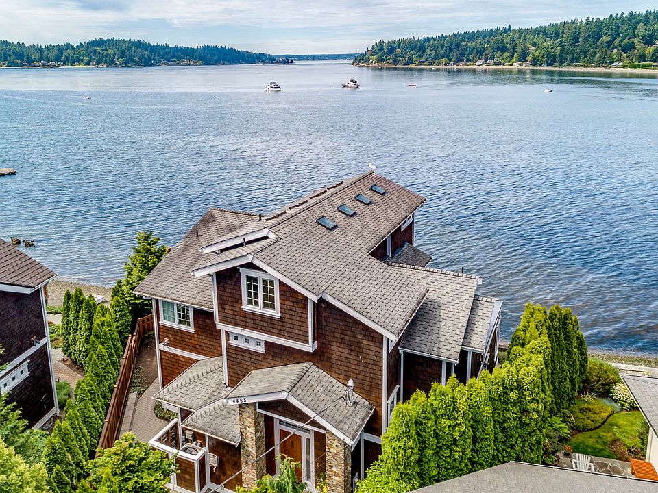 Impeccably maintained custom home perched above water's edge on the Island's coveted Gold Coast - Pleasant Beach Drive!