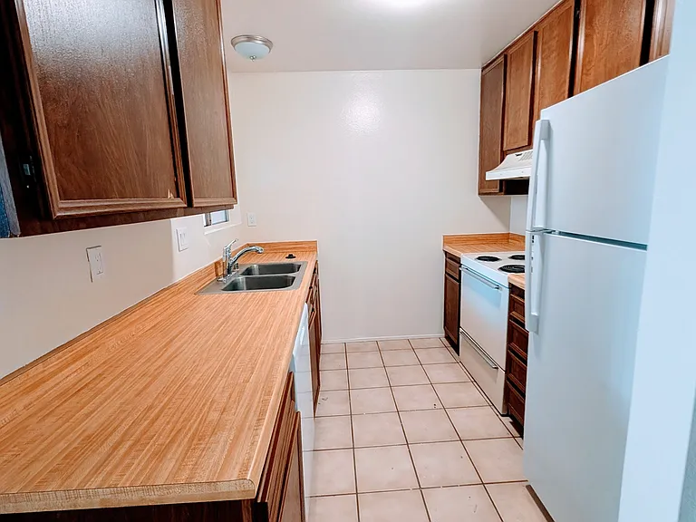 Kitchen has ample storage and a brand new dishwasher.