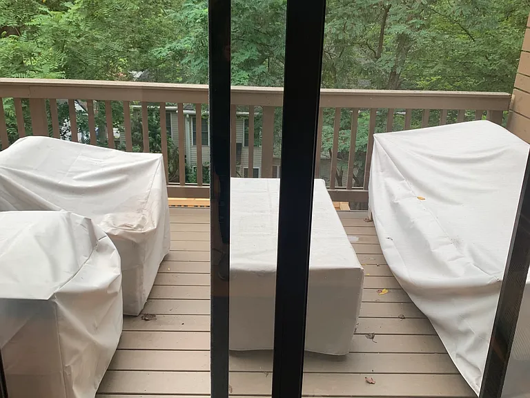View of upper/main level deck and brand new luxury outdoor furniture from the bonus room