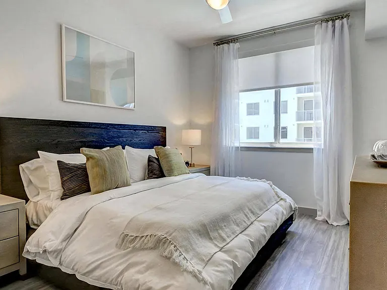 Oversized Bedroom with Natural Light and Modern Wood-Style Flooring