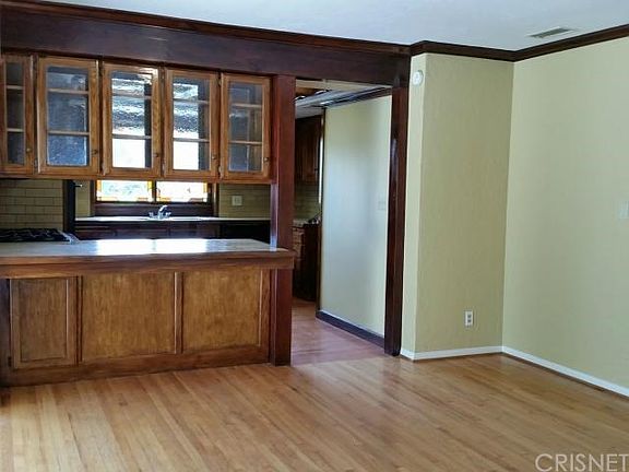 Living room/dining area opens to the kitchen with breakfast
