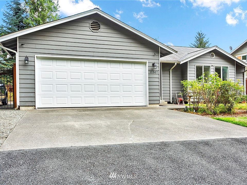 Fenced on both sides with gated RV parking.