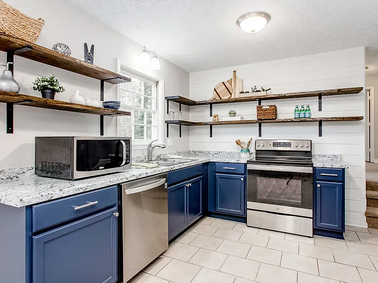 Beautiful kitchen with all new cabinets, open shelves and stainless steel appliances.
