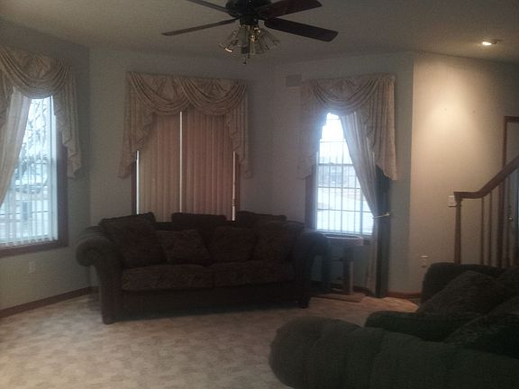Spacious living room adjoins formal dining.